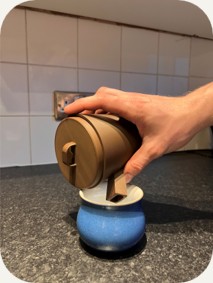 Jack pouring tea from the teapot into a cup