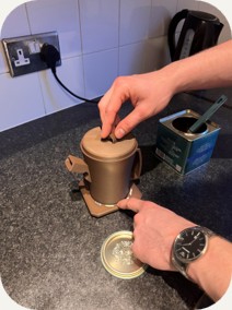 Jack setting the teapot on its base
