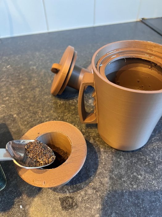 Step 3: Add a teaspoon of tea to the small strainer