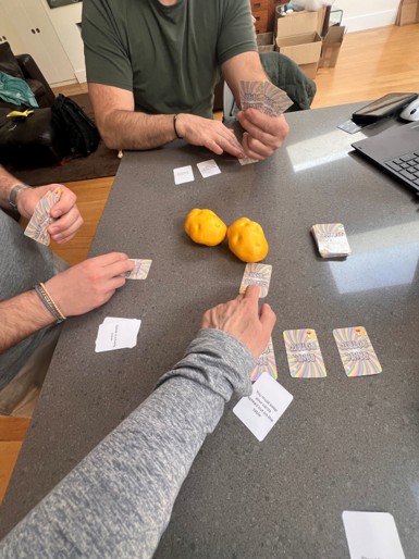 Players mid-game reaching for the foam potatoes