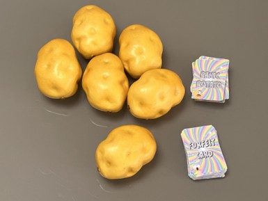 Six foam potatoes with the Panic Potato and forfeit card decks