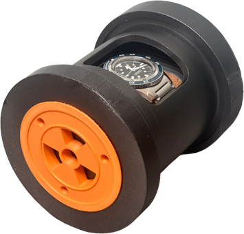 Printed capsule standing on end with the watch visible